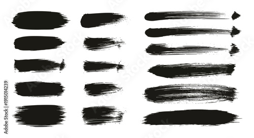 Collection of various black ink brush strokes and paint smears on a white background, showing different textures and lengths.