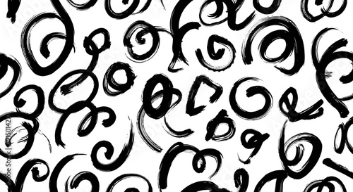 A seamless pattern of abstract black hand-drawn brush strokes and curly doodles on a white background, creating a modern artistic texture.