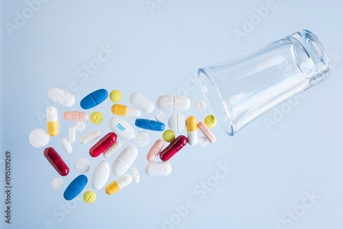 Tablets and pills of different types and colors.