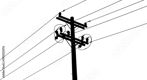 Overhead power lines utility mast silhouette against sky