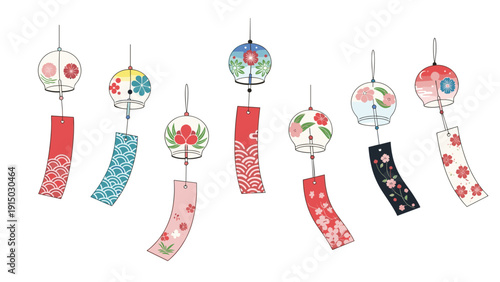 Beautiful collection of traditional Japanese glass wind chimes with colorful patterns and paper slips hanging on a white background.