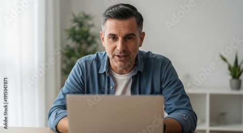 Wallpaper Mural Middle Aged Man Talking During Video Call on Laptop at Home Torontodigital.ca