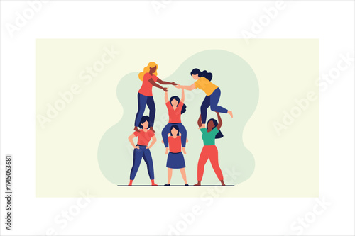 Diverse group of women forming a human tower or pyramid together in a friendly manner