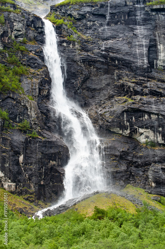 A waterfall falling from a high slope