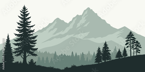 Majestic mountain range with dense forest in the foreground and misty peaks in the background