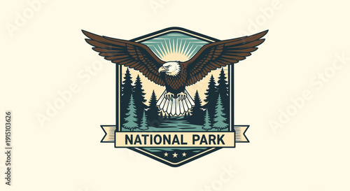 Vector illustration of an eagle with outstretched wings in front of a forest and sunburst, surrounded by a shield with a national park banner