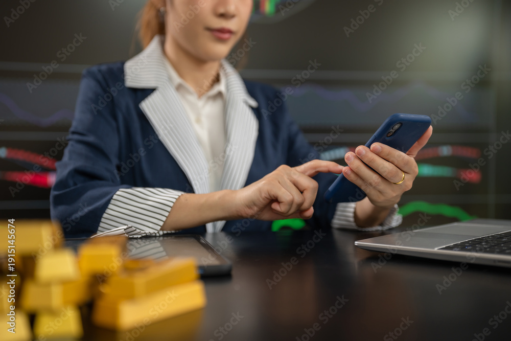 Fototapeta premium Businesswoman trading stocks online. Stock brokers looking at graphs.