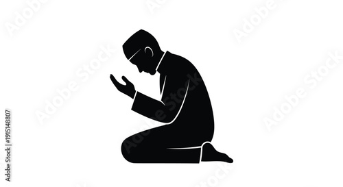 A man kneeling in prayer a striking black silhouette