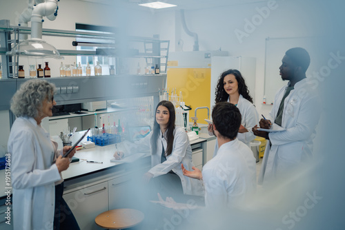 Wallpaper Mural Diverse science team collaborating in research laboratory meeting Torontodigital.ca