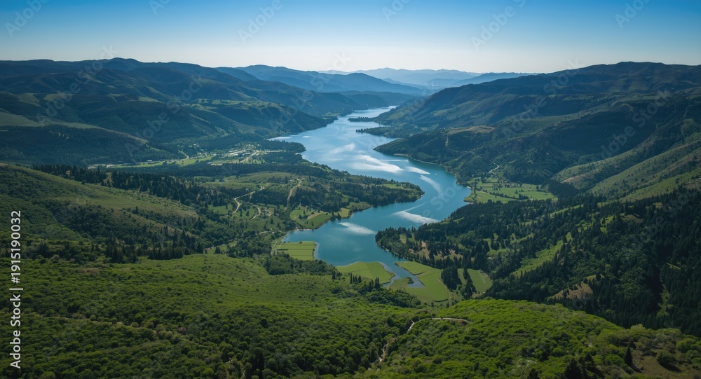 Obraz premium overhead image of a natural park valley surrounded by glimmering lakes