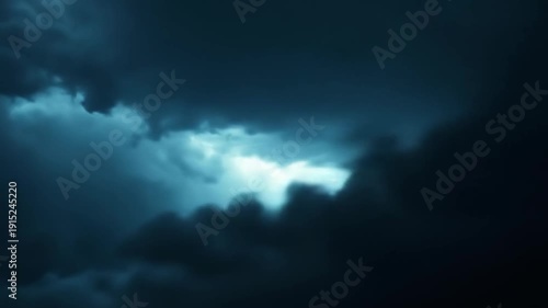 Dramatic storm clouds with lightning strike across a dark sky