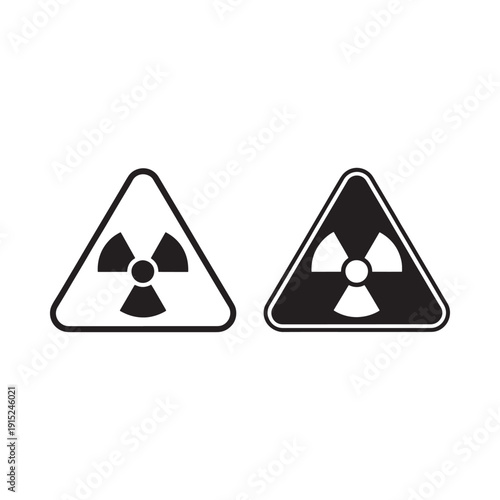 Two triangular warning signs displaying a radiation symbol in contrasting colors