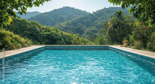 serene pool area enclosed by flourishing green hills