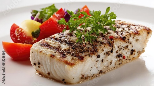 Grilled white fish fillet with a peppercorn crust, parsley garnish, served with tomato and greens on a white plate. Concept Grilled Fish Fillet, Peppercorn Crust, Parsley Garnish, Tomato and Greens