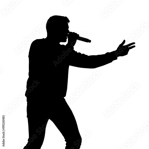 Silhouette of a male singer performing with a microphone on stage.