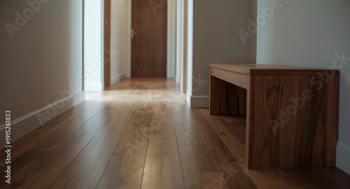 Sleek hallway area with wooden floor panels and bench for shoe storage