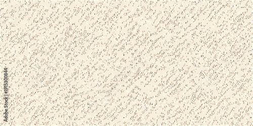 Close up of a textured light beige surface with a granular pattern
