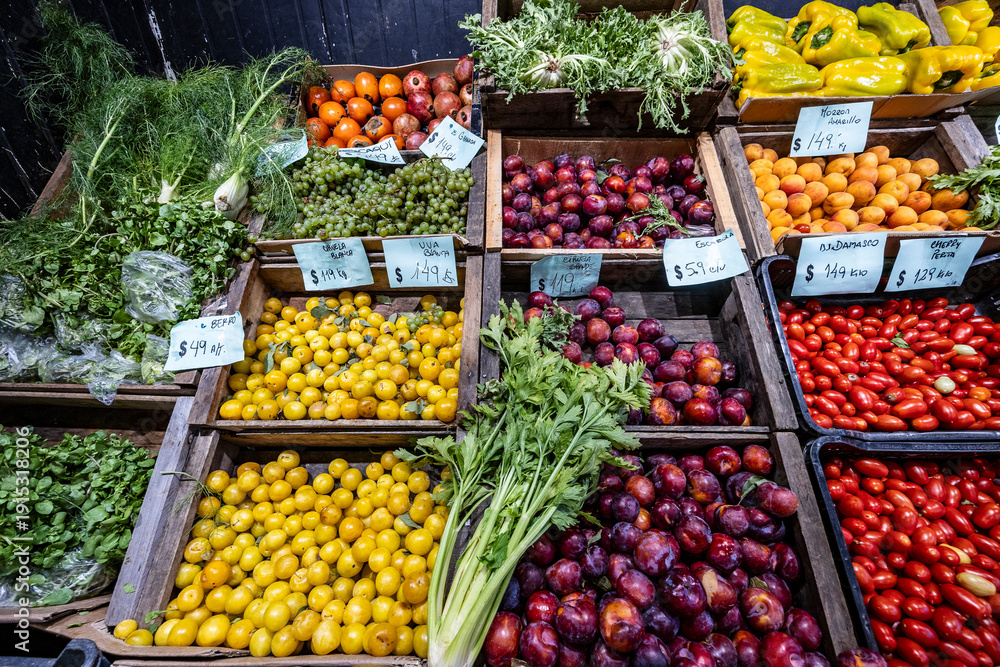 Obraz premium Fruits and vegetables displayed for sale at the Montevideo Agricultural Market, Uruguay.