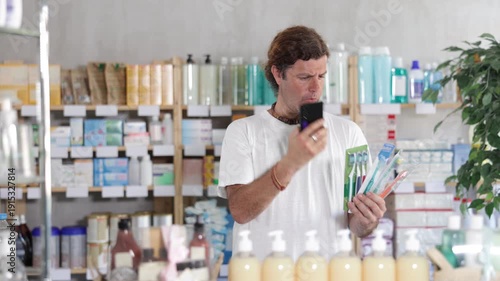 European scans the barcode on the packaging of toothbrushes on a mobile and pays using an online application on a mobile phone. Buyer in a pharmacy pays for purchases by QR. High quality 4k footage