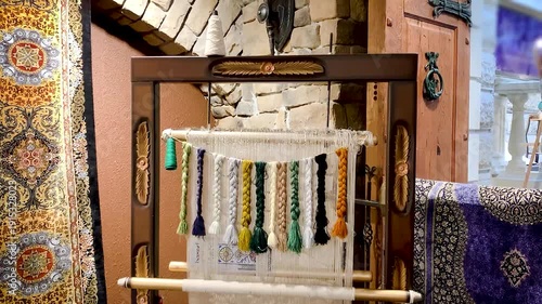 Carpet weaving machine handcrafted vintage old technology .thread materials Persian Arabic carpets wool silk