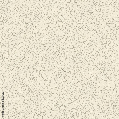 Seamless abstract pattern of fine cracks on a light background. This subtle texture evokes an aged and weathered surface, ideal for graphic design and creative projects