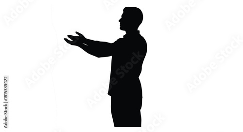 Silhouette of a man with arms outstretched presenting or gesturing towards something