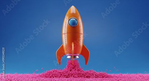 A small orange toy rocket on pink sand
