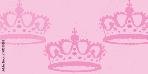 Repeating pattern of pink crowns against a solid pink background