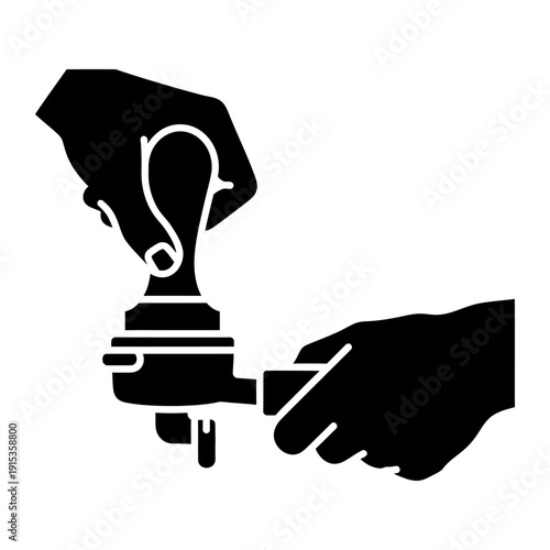Barista hands tamping coffee grounds in a portafilter for espresso preparation, black silhouette icon isolated on white background.