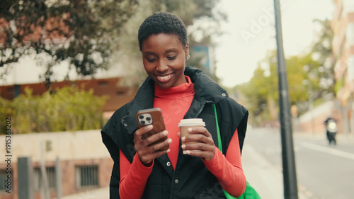 Wallpaper Mural Woman Smiling On Street With Phone And Coffee Torontodigital.ca