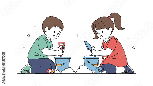 Two happy young children, a boy and a girl, kneeling in the sand while playing with buckets and shovels together.
