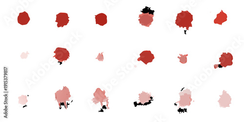 Abstract arrangement of crimson red blood splatters against a black background