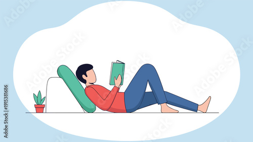 Young man relaxes on a comfortable green cushion while reading an interesting book in a peaceful home environment.