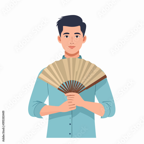 Man holding traditional hand fan, standing against a plain background, viewed from the front