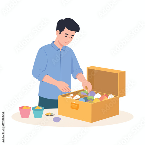 A man organizing colorful objects into a wooden chest on a table with a calm and focused expression from a slightly angled viewpoint