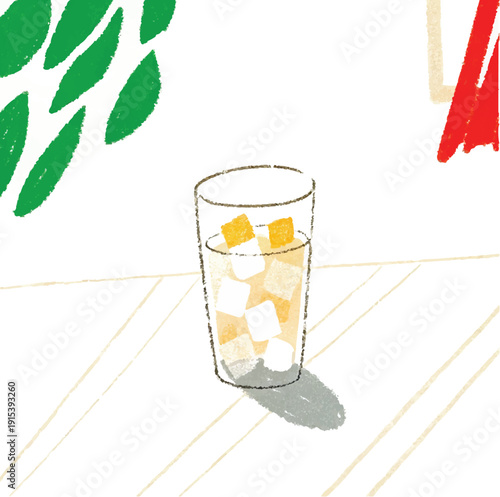 A tall glass of fresh ice cold drink with lemon and mint sits isolated as a healthy yellow fruit juice or citrus tea beverage