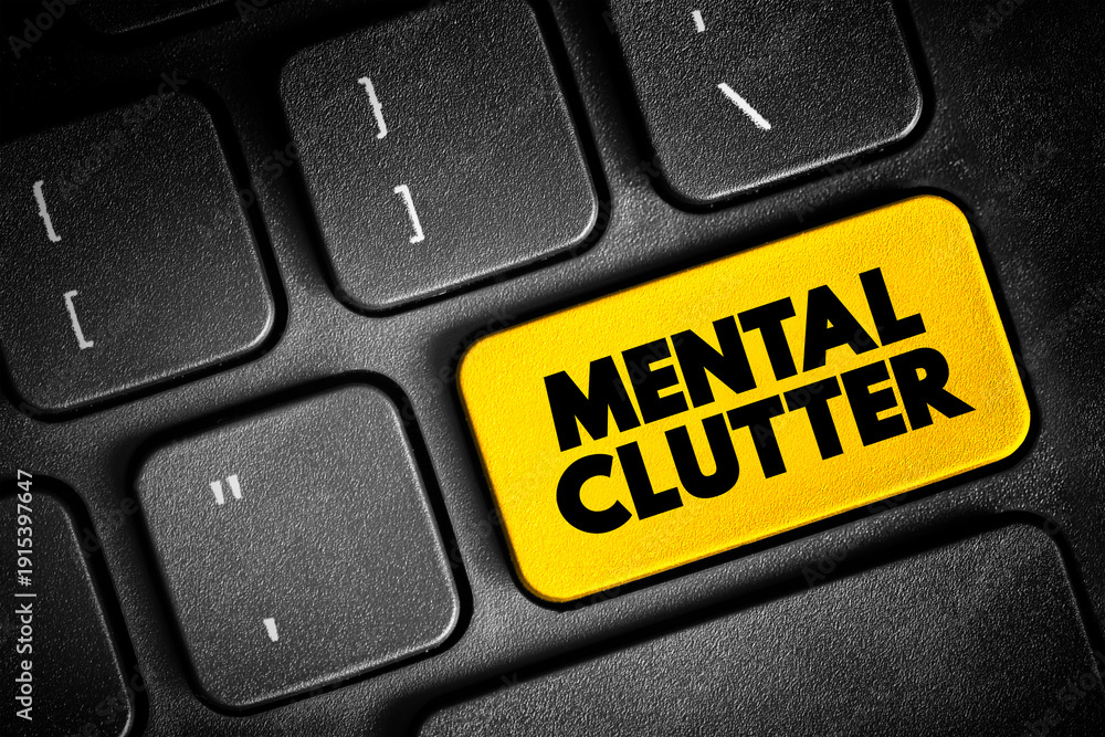 Fototapeta premium Mental Clutter - takes up space in our brain, but continues to live rent-free as we feed and otherwise sustain it, text button on keyboard, concept background