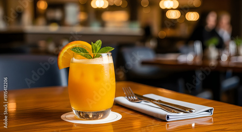 A refreshing orange cocktail on a restaurant table