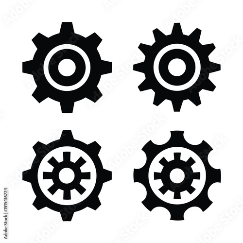 Four black and white gear arranged in a square pattern mechanical engineering