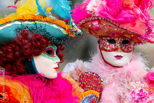 Women wearing traditional mask and costume. Annual venetian carnival of Annecy, Haute Savoie, France.