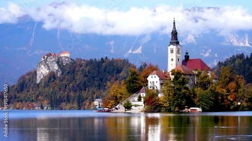 Breathtaking timelapse shot of lake bled island with pilgrimage church of the assumption of maria on a sunny summer day. European travel guides, historical documentaries, and peaceful nature