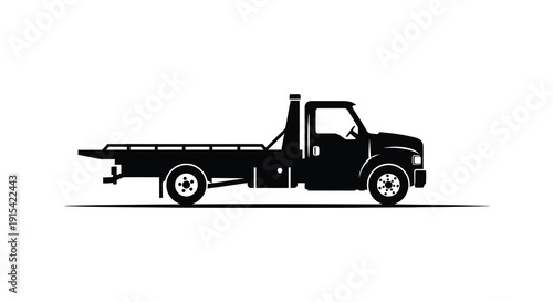 A stark black silhouette of a flatbed tow truck is prominently displayed against a clean white background silhouette