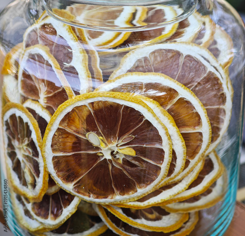 Glass jar  filled with dried lemon slices