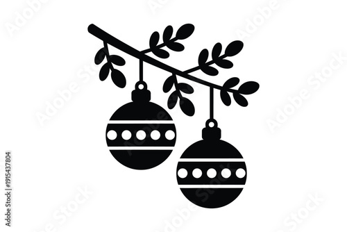 Festive Christmas ornaments hang from a pine branch, evoking holiday cheer and winter celebration.