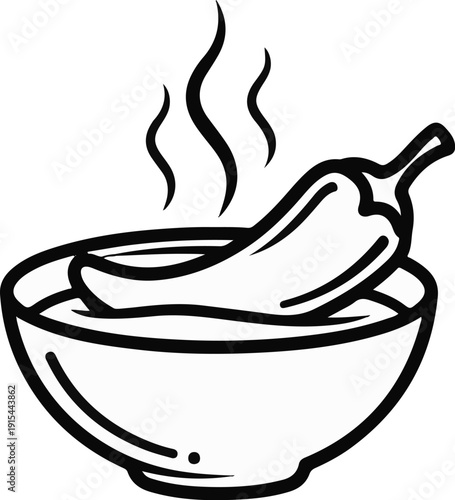 A steaming chili pepper is dipped in a bowl of liquid