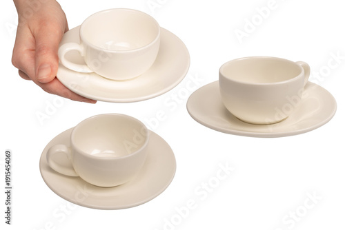 Konstfotografi Female hand holding coffee cup and saucer isolated on white background