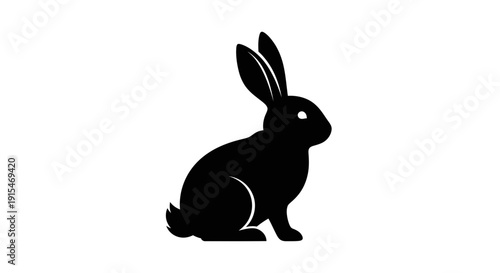 Black silhouette of a rabbit sitting upright.
