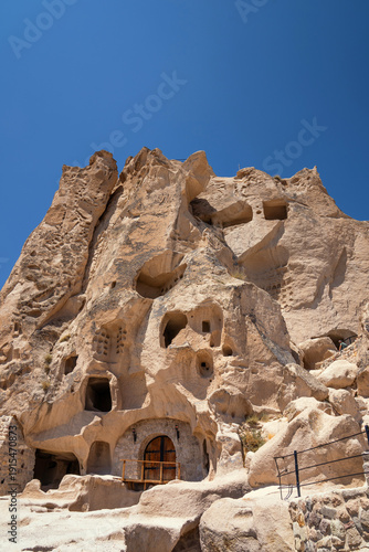 Uchisar castle, a unique historical building formed by carving a huge volcanic rock for defence and and settlement. Cappadocia, Turkey.