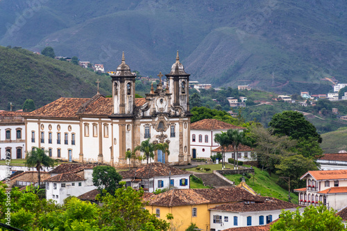 Ouro Preto, Brazil: Dramatic view of the Ouro Preto town with the Church of Our Lady of Mount Carmel in the lush hill in Minas Gerais, Brazil