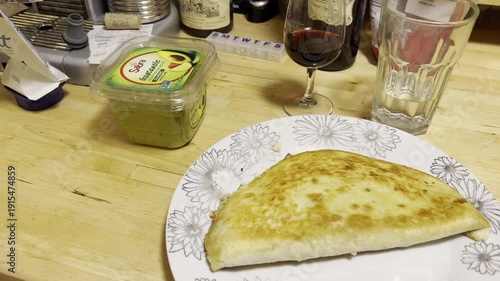 homemade enchiladas with a glass of red wine